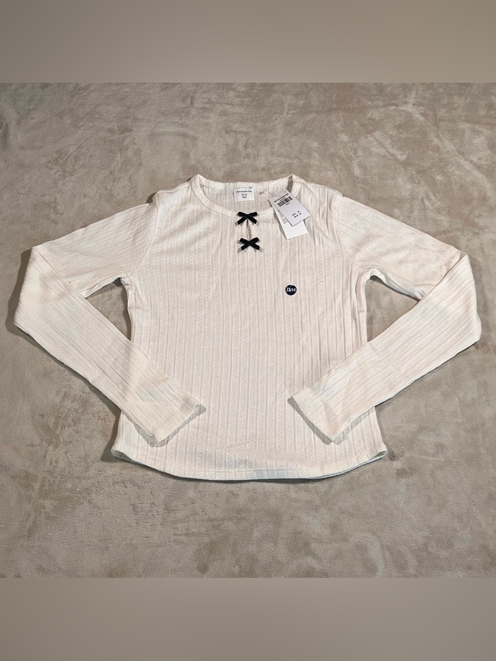 abercrombie kids Cream Ribbed Long-Sleeve Top with Black Bow Accents - Picture 1 of 3